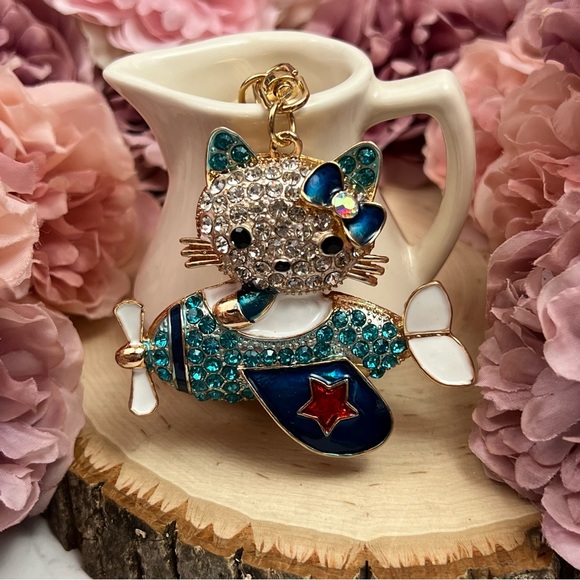 Hello Kitty Flying a Bkue Crystal Airplane Keychain Charm - Picture 4 of 16